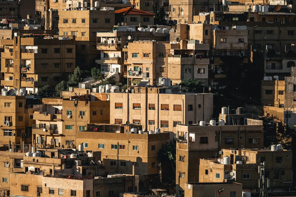 Amman’s stone houses on a hillside in golden afternoon light