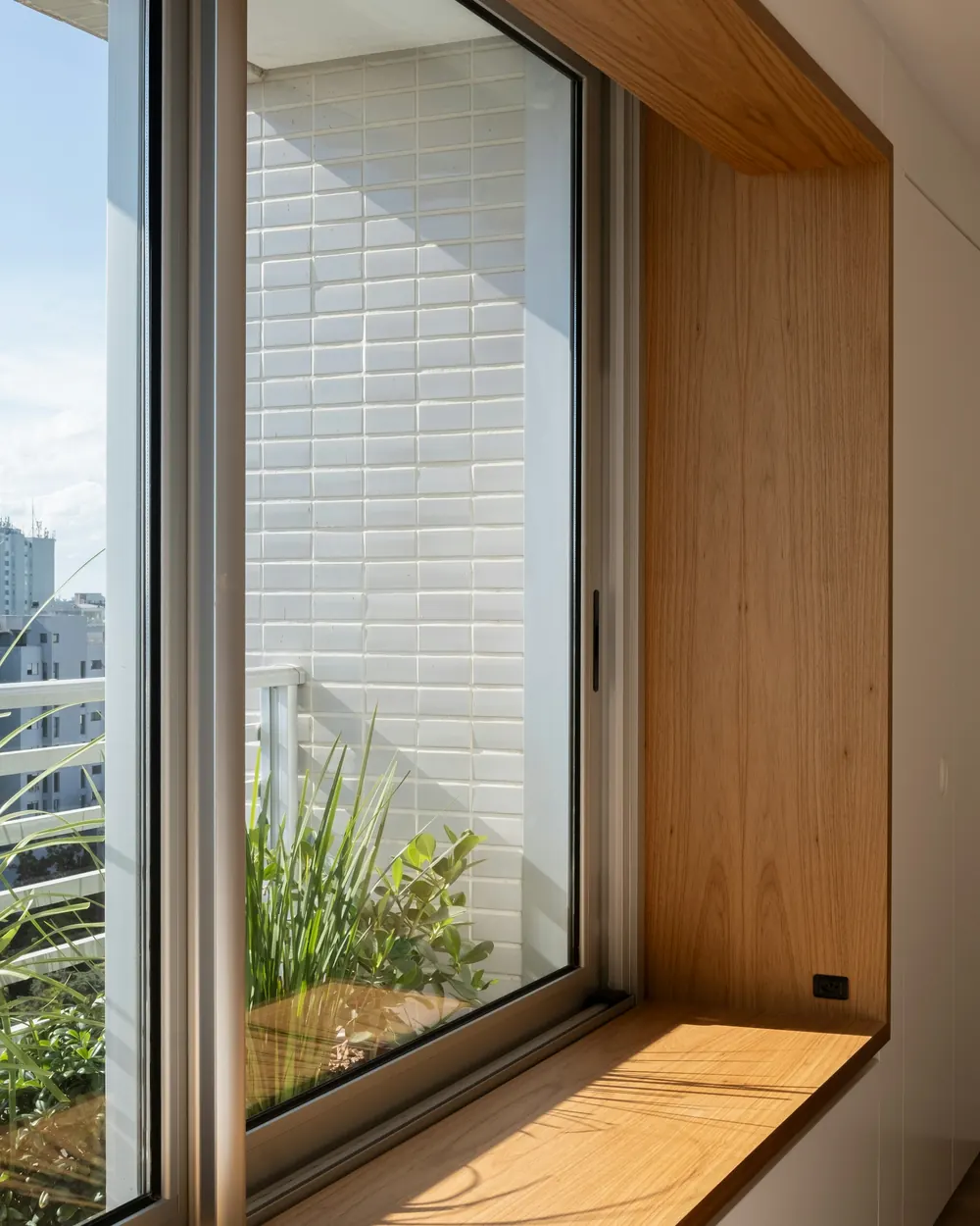 An oak window seat overlooking the rooftops