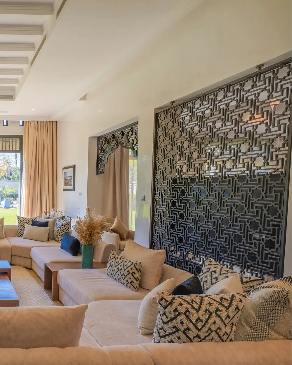 The timber fretwork screen and the brass lanterns