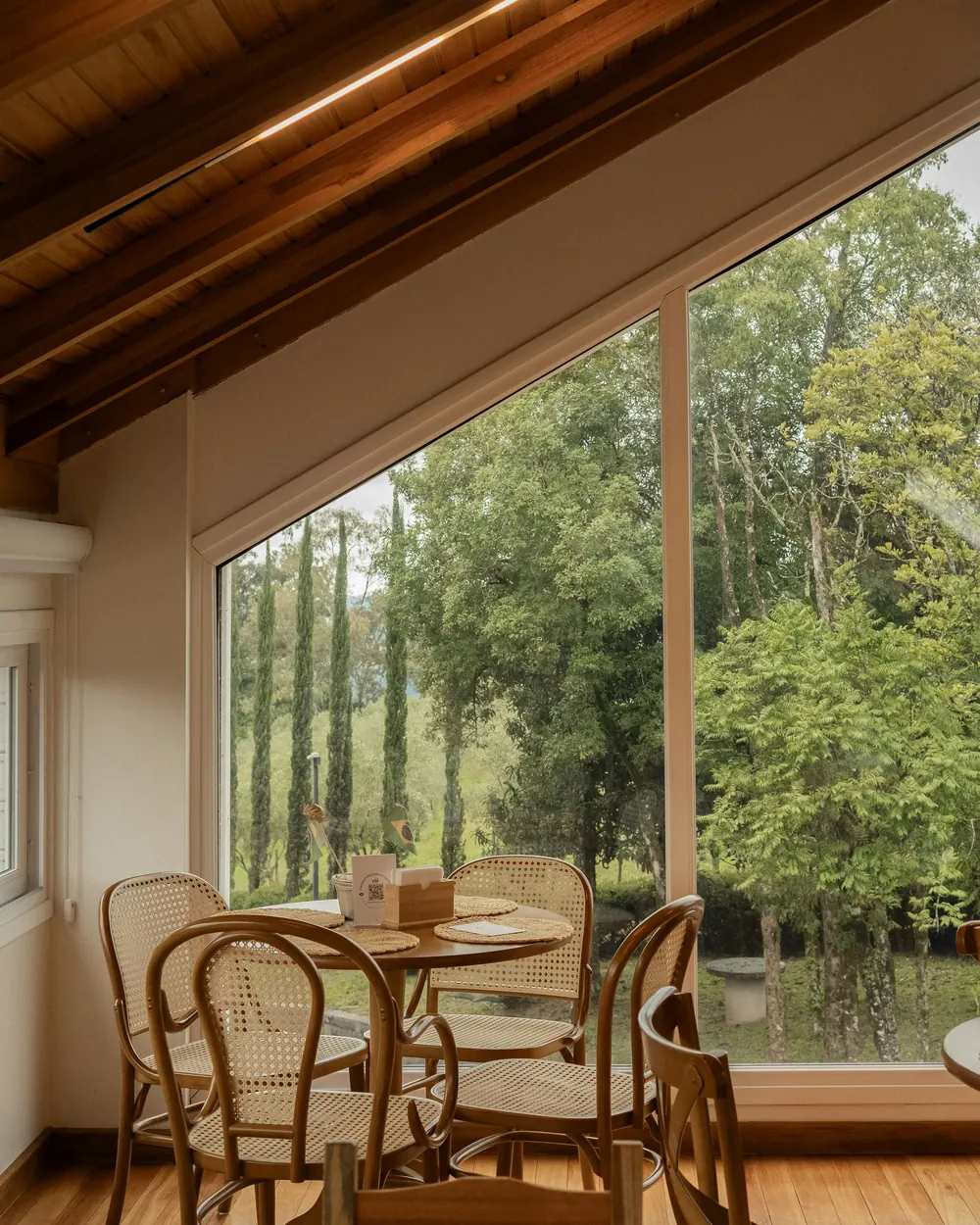 The glass room under its pitched timber roof
