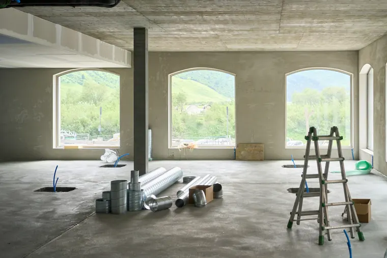 A shell space with arched windows before the fit-out starts